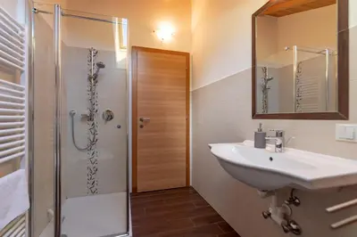 a bathroom with a sink and a shower at Obergruberhof in Chiusa