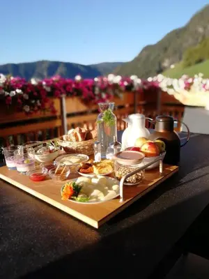 a tray of food on top of a table at Obergruberhof in Chiusa