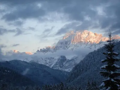 a drawing of a mountain range with snow at Hotel San Giusto in Falcade