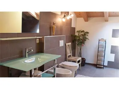 a bathroom with a sink and a toilet at Lexnhof in Montagna