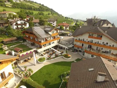 an aerial view of a town with buildings at Hotel Oberwirt in Feldthurns