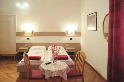 a hospital room with a table with flowers on it at Albergo Casagrande in Laives