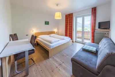 a living room with a bed and a couch at Hotel Untermelz in Plaus