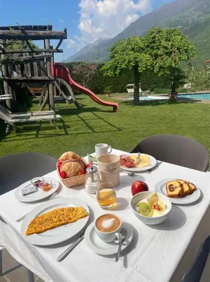 a white table with breakfast food on it at Hotel Untermelz in Plaus