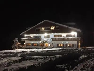a group of people posing for a picture at Hotel & Ristorante Baita Dovich in Malga Ciapela