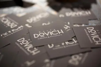a pile of dyslexia signs on a table at Hotel & Ristorante Baita Dovich in Malga Ciapela