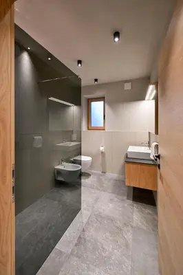 a bathroom with a sink and a toilet and a shower at Residence Winklgut in Lagundo