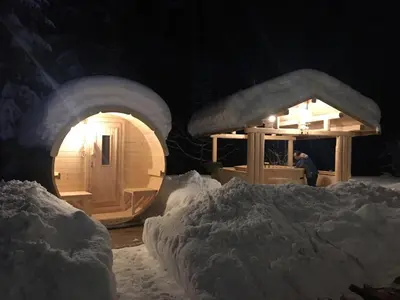 a couple of igloo houses in the snow at night at Hotel Garnì Il Cirmolo in Rocca Pietore