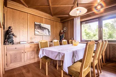 a dining room with a table and chairs at Chalet Luis in Falzes
