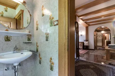 a bathroom with a sink and a mirror at Chalet Luis in Falzes