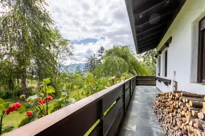 a balcony with a view of a garden at Chalet Luis in Falzes