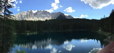 a view of a lake with a mountain in the background at La Casa del Mulino in Pozza di Fassa
