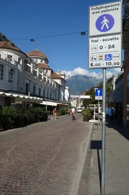 a street sign on the side of a street at Hager Apartment in Merano