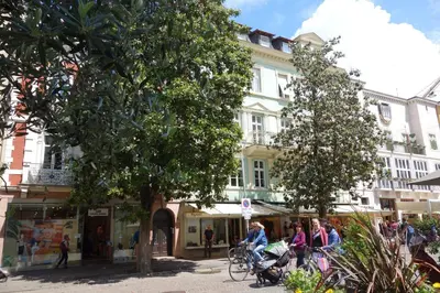 a group of people riding bikes on a city street at Hager Apartment in Merano