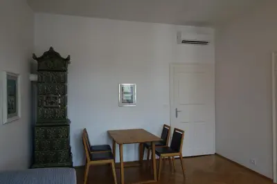 a dining room with a table and chairs at Hager Apartment in Merano