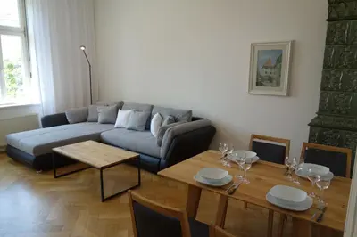 a living room with a couch and a table at Hager Apartment in Merano