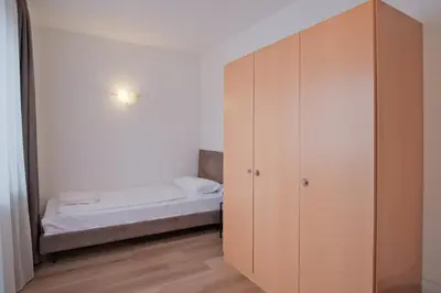 a bedroom with a closet and a bed at Almarett in Racines