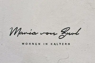 a sign that says marina your butt written on a wall at Maria von Buol - Wohnen in Kaltern in Caldaro