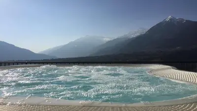 a hot tub with a view of mountains at Penthouse Skygarden in Schenna