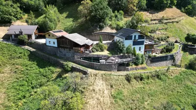 an aerial view of a house on a hill at Brentwaldhof Appartements in Cornedo all'Isarco