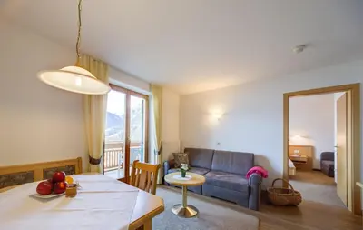 a living room with a couch and a table at Residence *** Geringerhof in Schenna