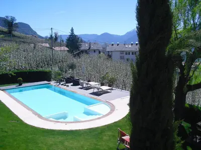 a swimming pool in the yard of a house at Residence *** Geringerhof in Schenna