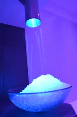 a bowl of white powder with a green light at Hotel Ladina in Campitello di Fassa