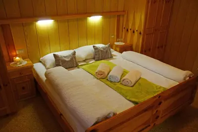 a large bed with towels on top of it at Piz da Cir in Colfosco