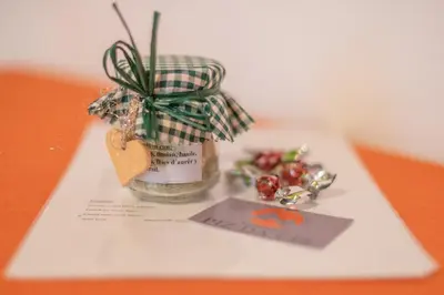 a glass jar with a plant in it with a tag at Piz da Cir in Colfosco
