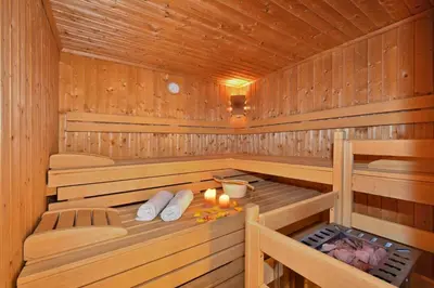 a wooden sauna with candles and candles in it at Pension Tasa in Valles
