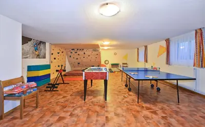 a room with two ping pong tables in it at Pension Tasa in Valles