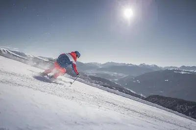 a person is skiing down a snow covered slope at Pension Tasa in Valles