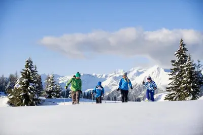 a group of people on skis in the snow at Pension Tasa in Valles