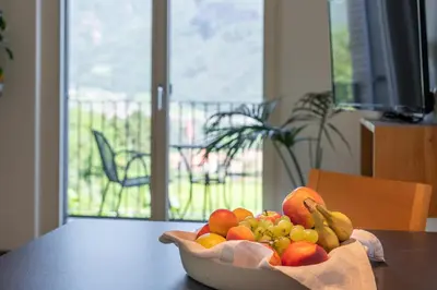 a bowl of fruit sitting on top of a table at Pension Gruenwald in Andrian