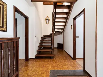 a hallway with stairs in a house at Apartment in Predazzo near Dolomites Trails in Predazzo