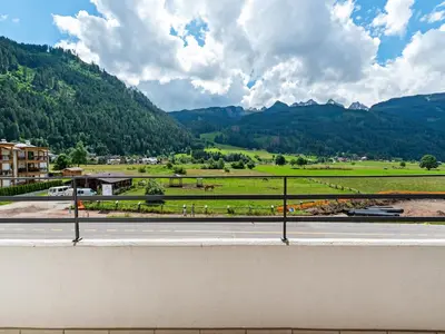 a view of a road with mountains in the background at Apartment in Predazzo near Dolomites Trails in Predazzo