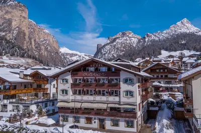 a hotel in the mountains with snow at Astor Suites B&B in Selva di Val Gardena