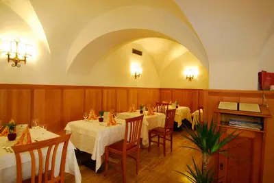 a collage of pictures of different types of food at Hotel Andreas Hofer in Egna