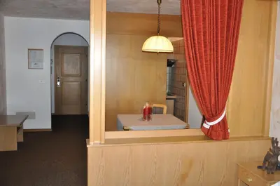 a room with a window with a bed in it at Residence Anda in Pozza di Fassa