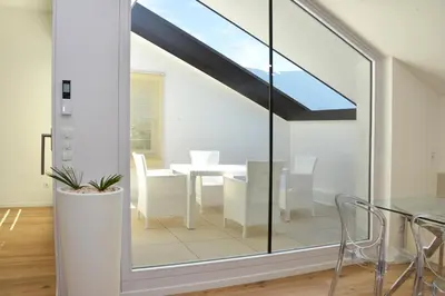 a skylight in a dining room with a table and chairs at Traubenhof in Magrè allʼ Adige