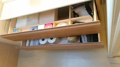 a cupboard filled with lots of items in a room at Traubenhof in Magrè allʼ Adige