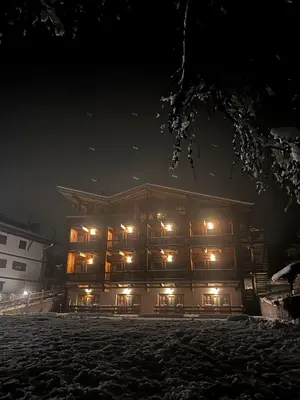 a large building at night with lights on at Residence Valpiccola in Val di Zoldo