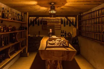 a wooden dining room with a table and chairs at Chalet Gratznhäusl in Ridanna
