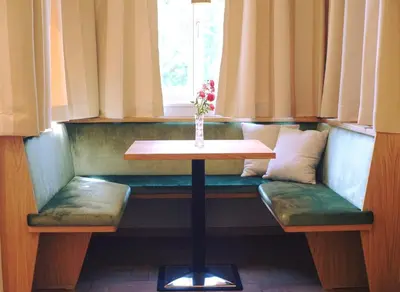 a hallway with a door leading to a dining room at Hotel Jarolim in Bressanone