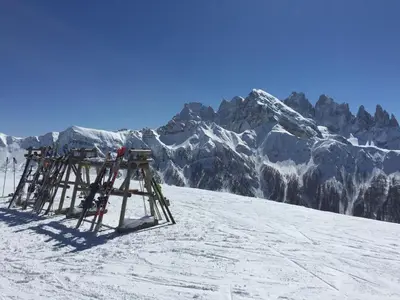 a ski lift on top of a snow covered mountain at Hotel La Serenella in Moena