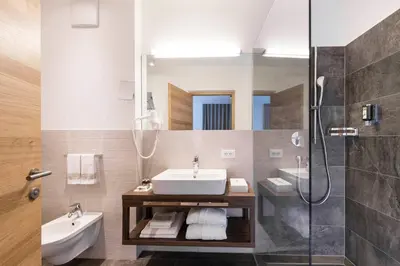 a bathroom with a sink and a shower at Hotel Gasserhof in Bressanone