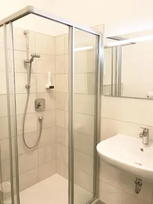 a bathroom with a shower and a sink at Manzoni Premium in Merano