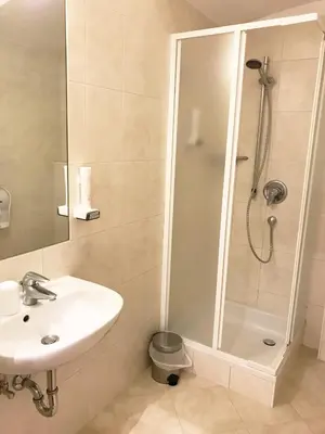 a bathroom with a shower and a sink at Manzoni Premium in Merano