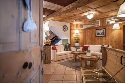 a hotel with a large building with a balcony at Hotel Edelweiss in Braies