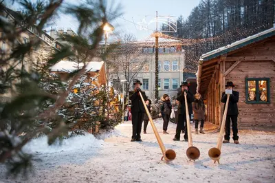 a group of people playing baseball in the snow at Apartment Obermair in Brunico